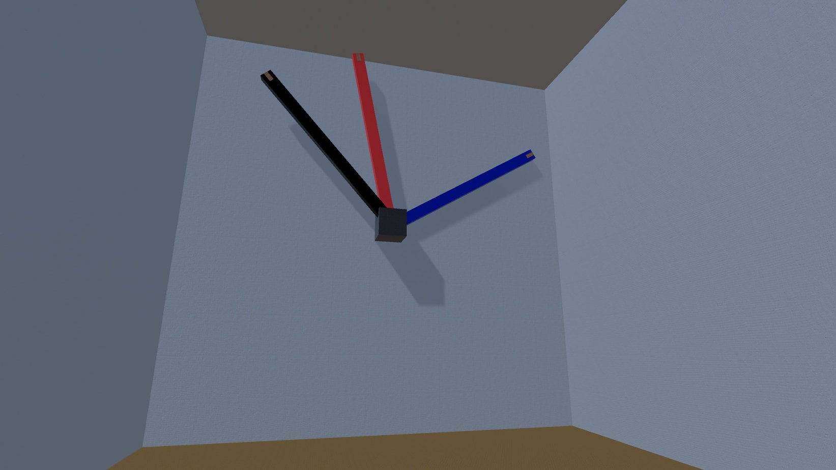 Minimalist wall clock with black, red, and blue hands mounted on a gray corner wall.
